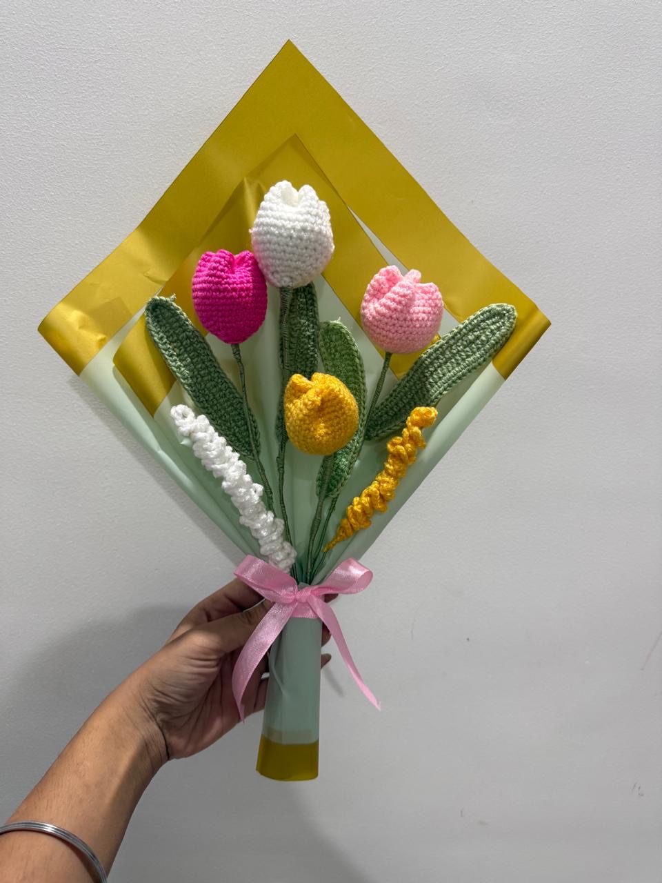 Crochet tulip bouquet in pink, white and yellow wrapped in gold and mint paper